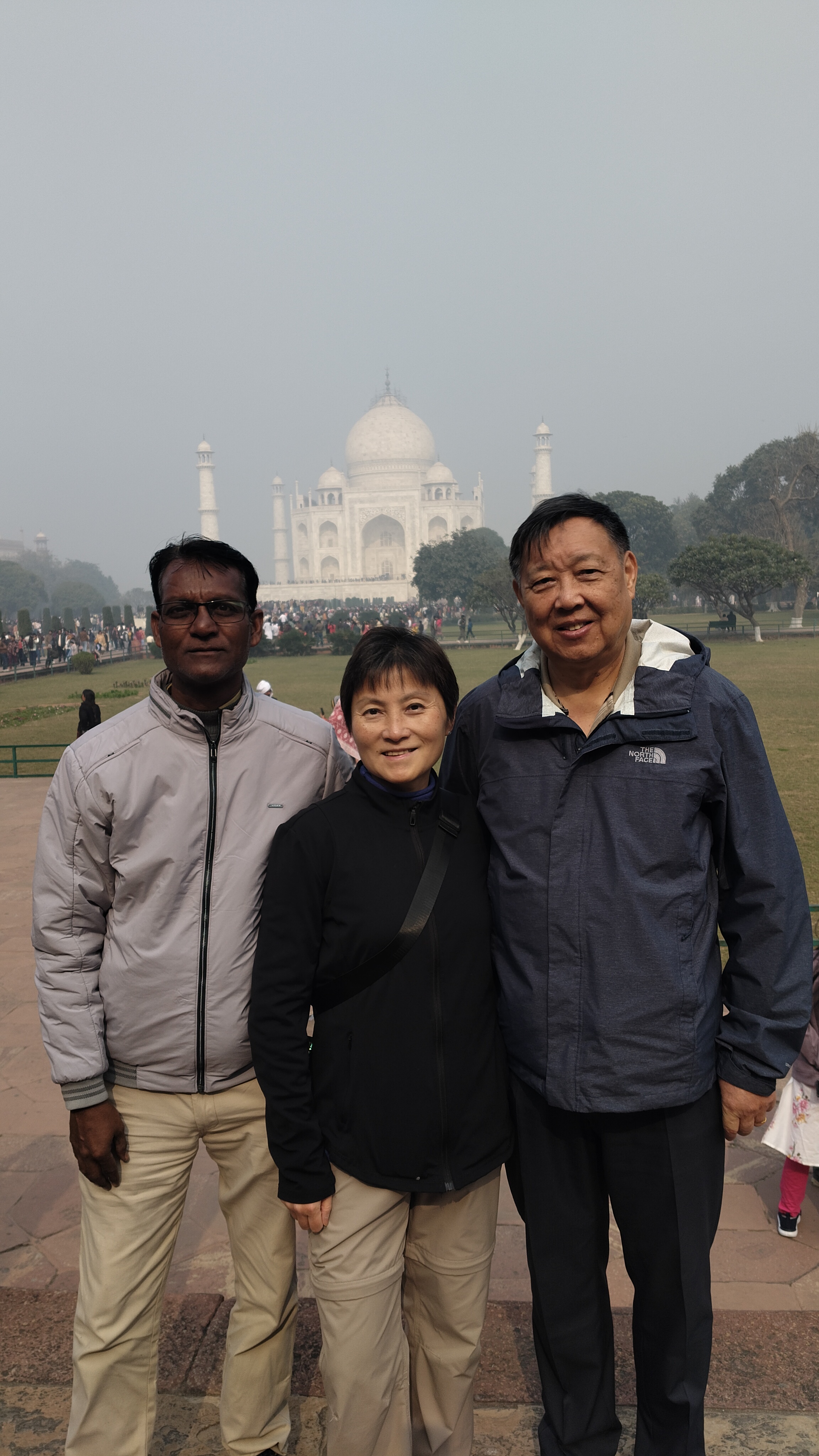 Mr. Verma with tourists smiling